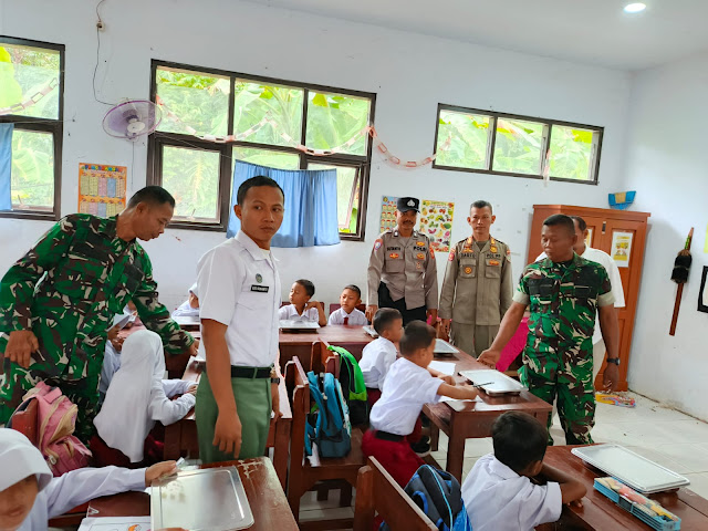 Launching Perdana MBG di Tukdana, Polisi dan TNI Dampingi Pembagian 269 Paket Makan Bergizi